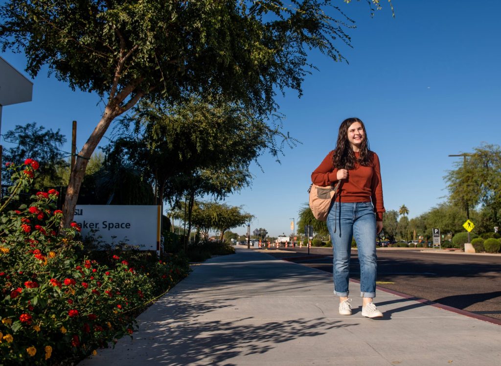 Woman walking on street near ASU campus