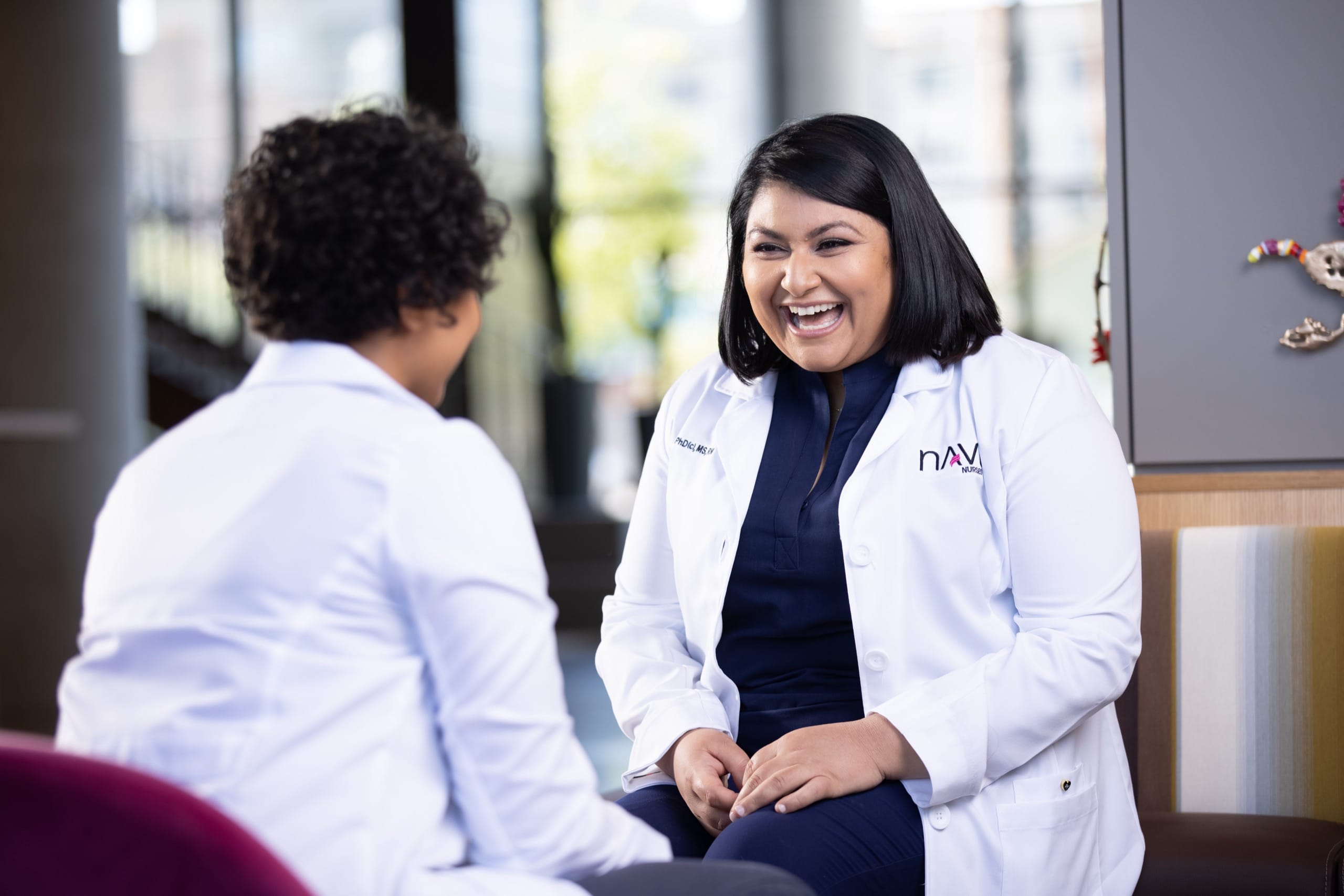 Two healthcare workers talking