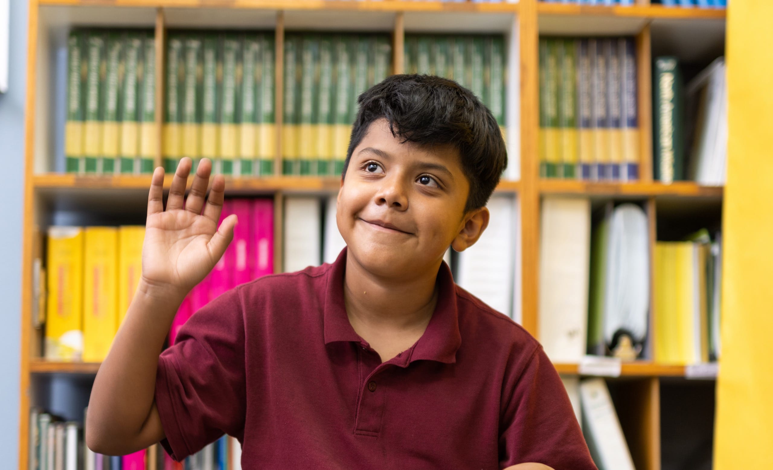 Child raising his hand