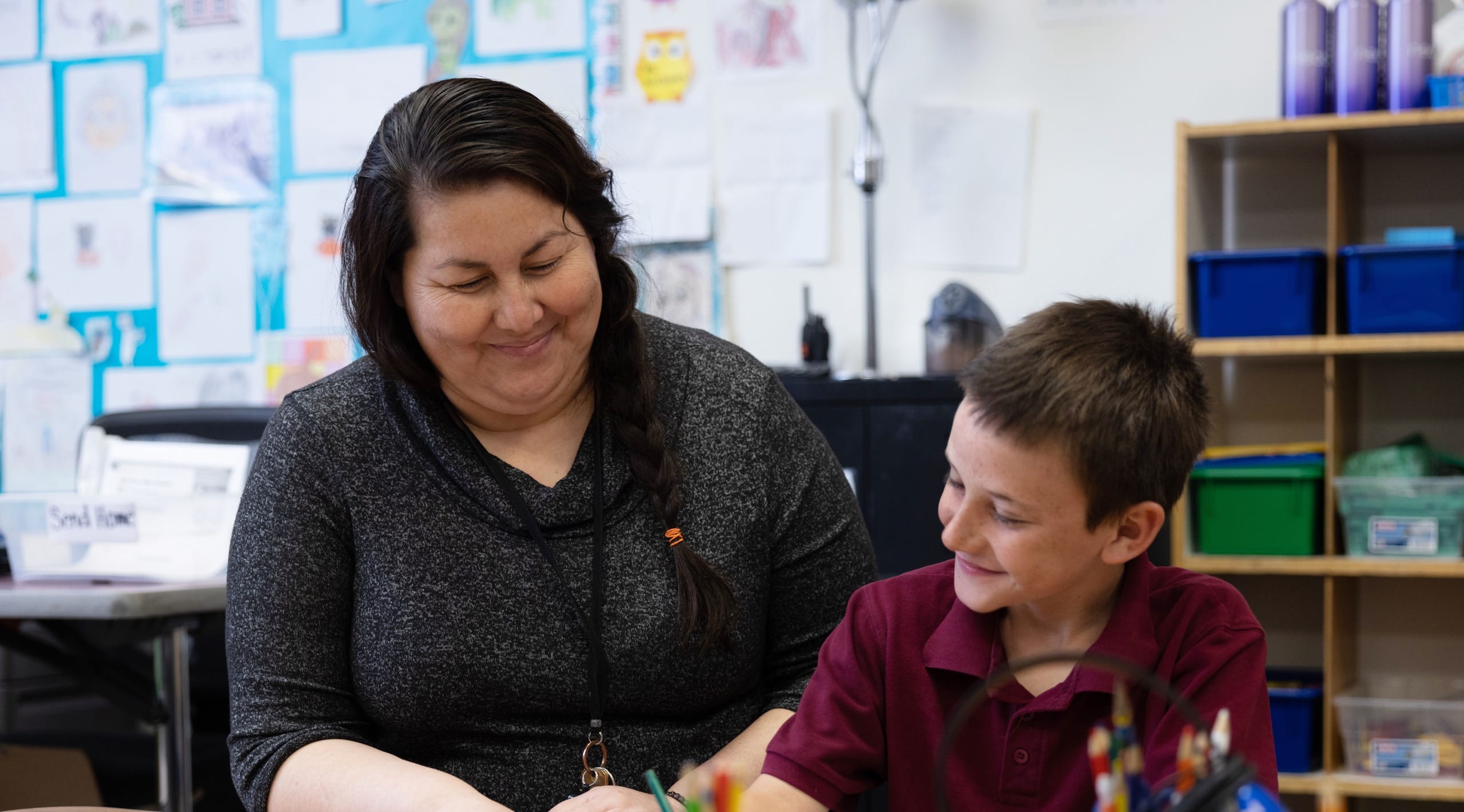 Teacher with child in classroom