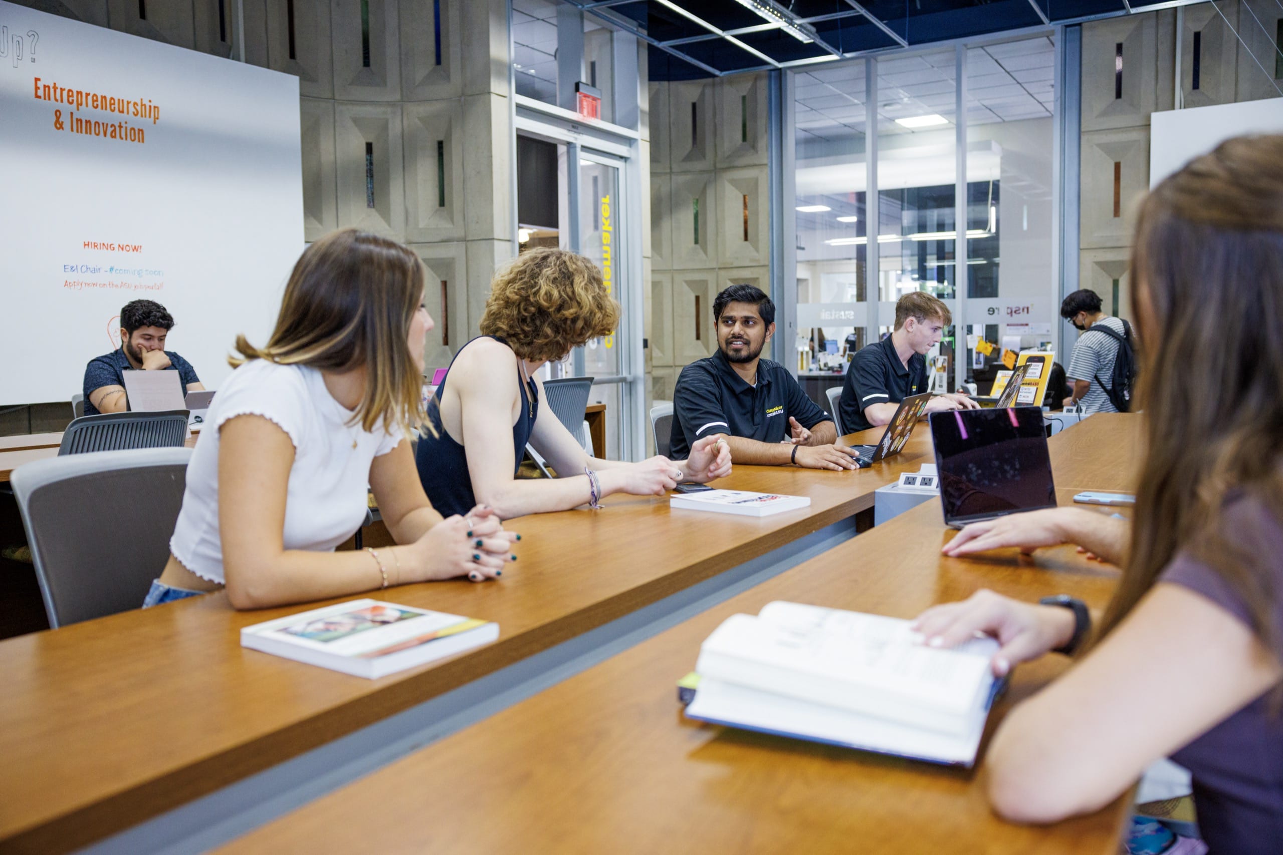 Employees sitting at table