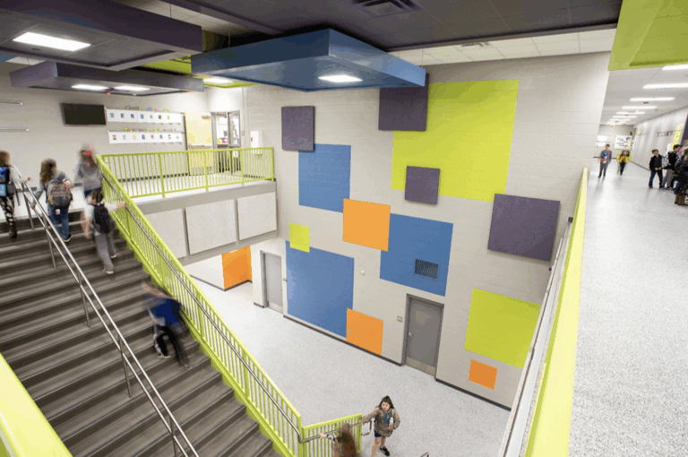 Gentry High School - overhead view in the main hallway with students walking up and down the staircase