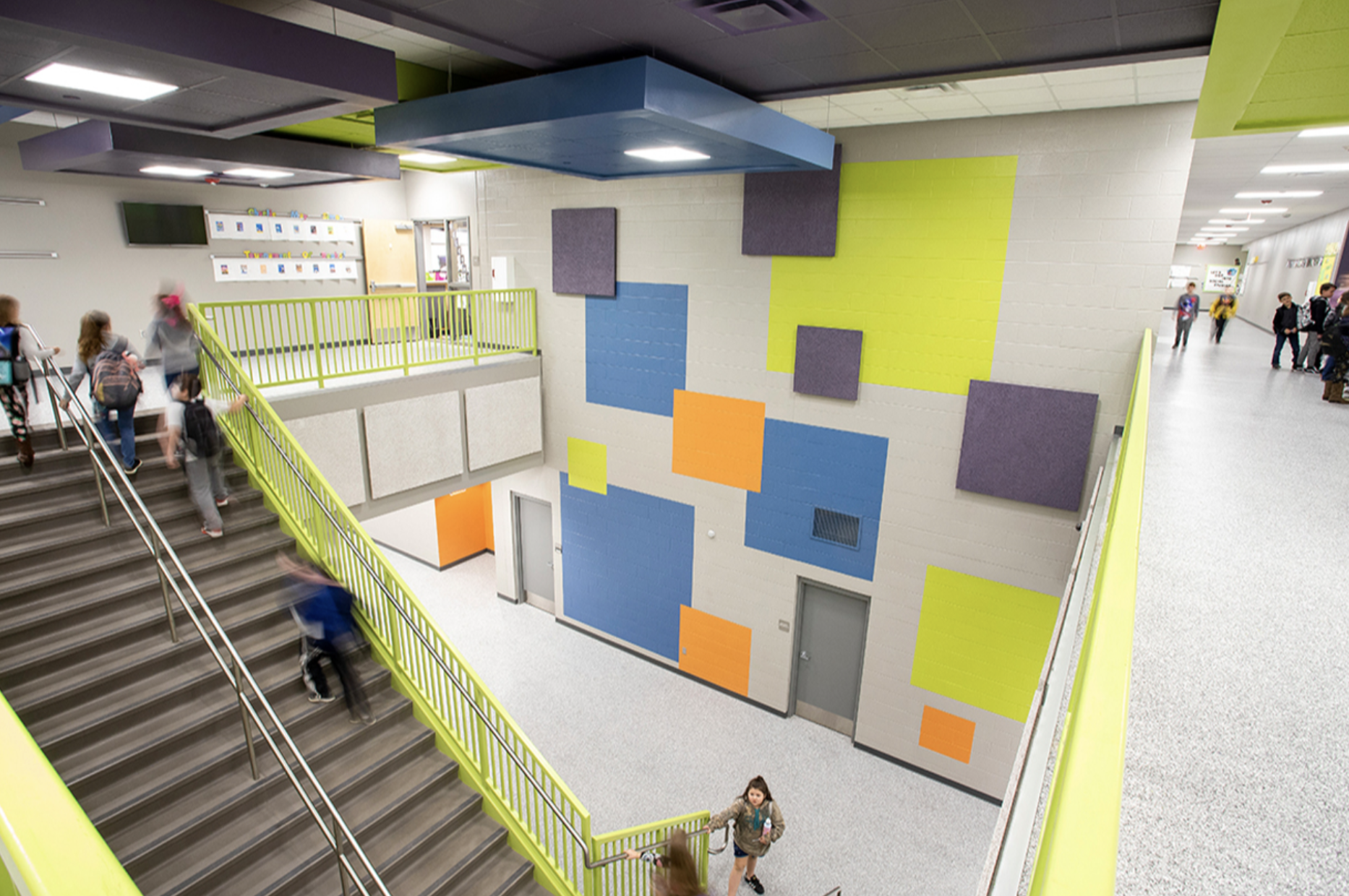 Gentry High School - overhead view in the main hallway with students walking up and down the staircase