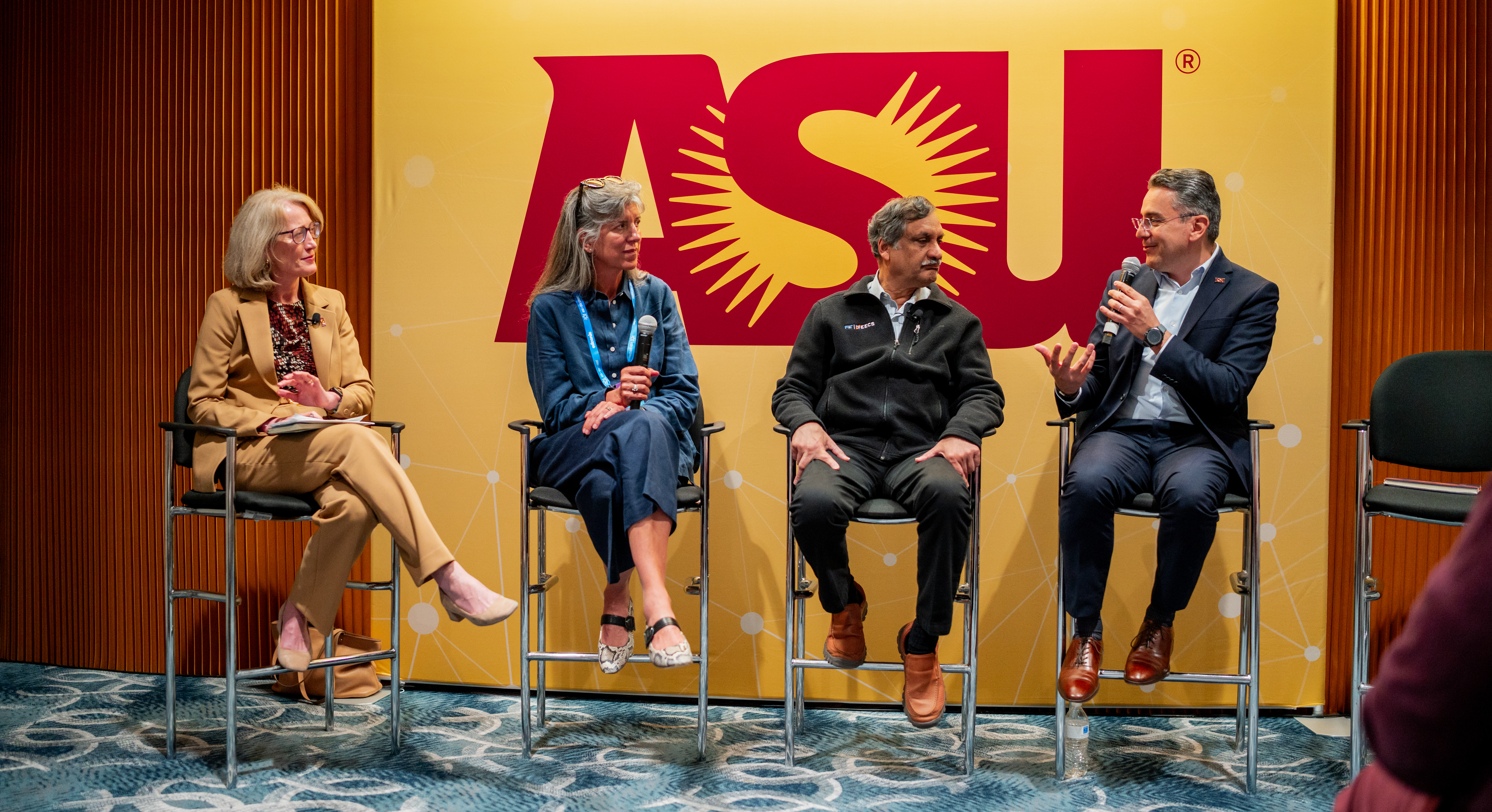Kristin Lord moderates a panel alongside speakers Marni Baker-Stein, Anant Agarwal and Marco Serrato.