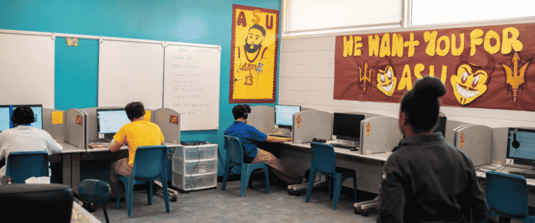 Students sit at laptops working on Arizona State University coursework inside a dedicated computer lab classroom at Maricopa County's Durango Juvenile Detention Center.