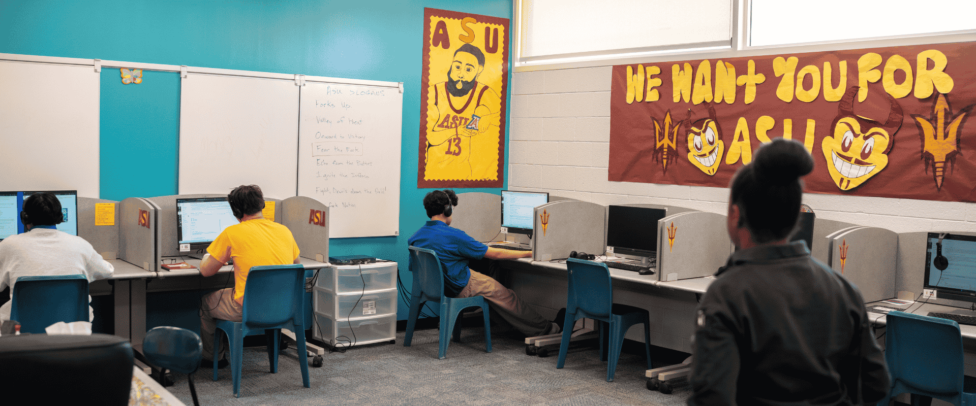 Students sit at laptops working on Arizona State University coursework inside a dedicated computer lab classroom at Maricopa County's Durango Juvenile Detention Center.